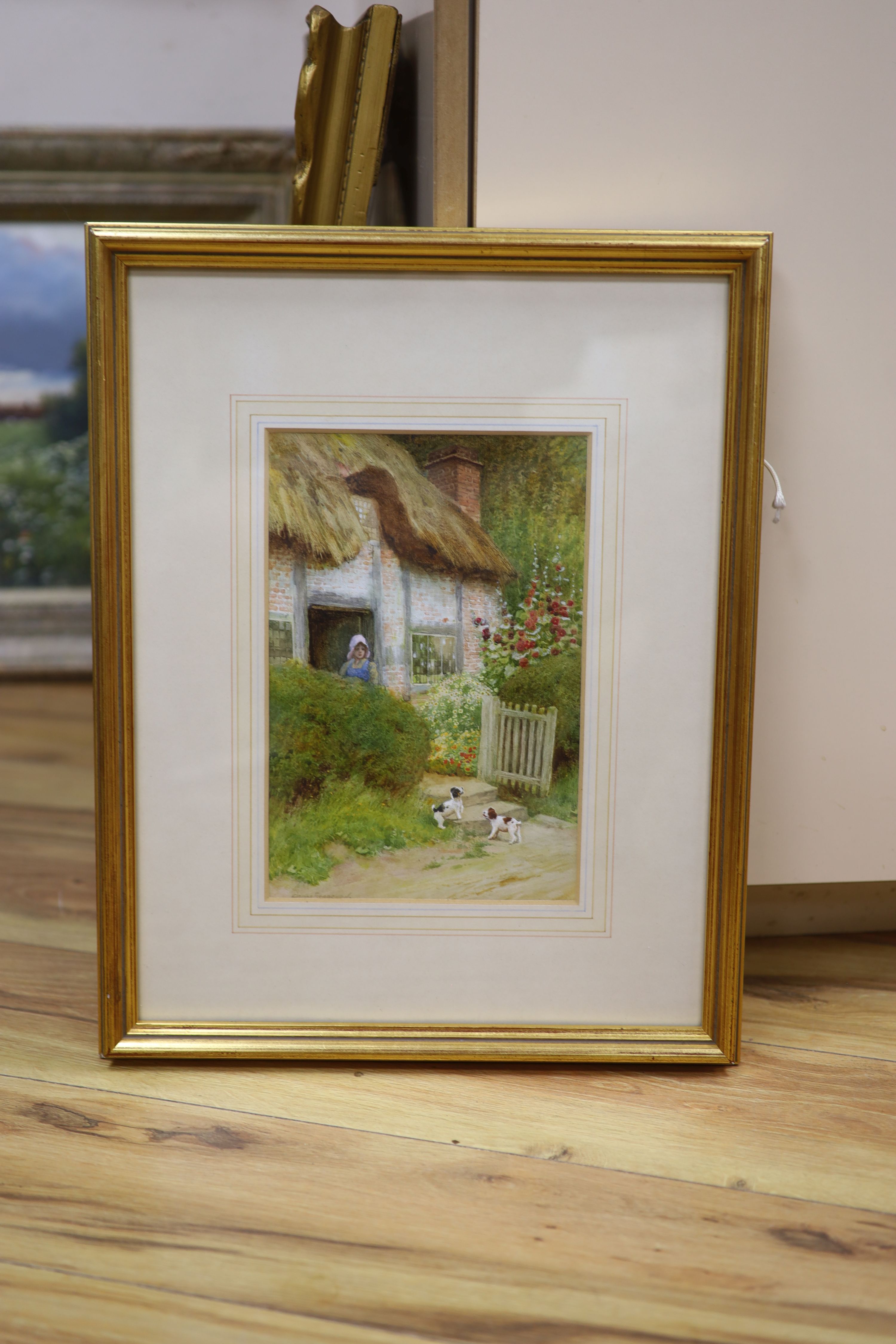 Arthur Claude Strachan, (Scottish, 1865-1938), watercolour, 'At Evesham', puppies beside a cottage, signed, 26 x 17cm